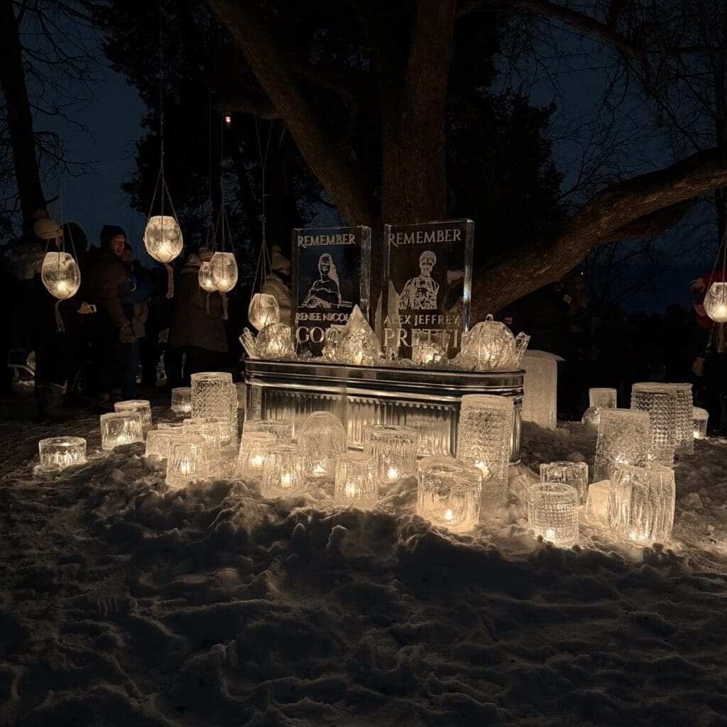 An ice sculpture memorial to Renee Good and Alex Pretti, illuminated by candles in lanterns made of ice